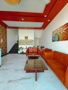 a living room with a couch and a table at Awadh Samrat Resort in Ayodhya