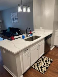 a kitchen with a sink and a counter top at Parkside at Avalon Park in Orlando