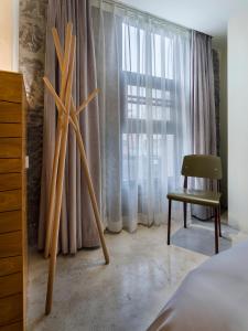 Postel nebo postele na pokoji v ubytování Zhuhai Bei Shan Ju Art Hotel