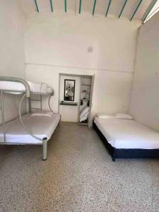 Кровать или кровати в номере Hermoso apartamento Colonial
