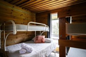 a bedroom with two bunk beds in a cabin at The Ranch Mornington Peninsula in Boneo