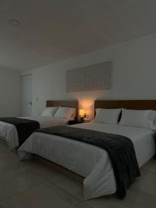 Ein Bett oder Betten in einem Zimmer der Unterkunft DUNAMIS HOTEL