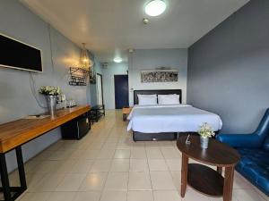 Posteľ alebo postele v izbe v ubytovaní Phusuang Place