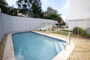 a swimming pool in the backyard of a house at Luanda Unit 7 7a Bulcock Beach Esp Bulcock Beach in Caloundra