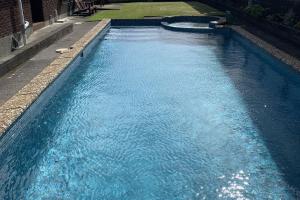 an overhead view of a pool of blue water at Blast On Hine in New Plymouth