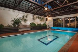 a large swimming pool with blue water at Family Fun Swimming Pool Spa Pool in New Plymouth