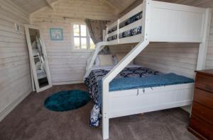 a bedroom with bunk beds in a tiny house at The Homestead Rural Family Retreat in Sentry Hill