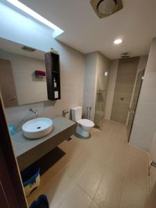 a bathroom with a sink and a toilet and a shower at Wan's Studio (Kota Bharu City Point) in Kota Bharu