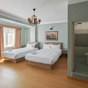 Letto o letti in una camera di Boudha Apart Hotel