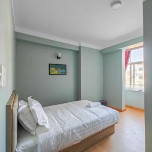 Letto o letti in una camera di Boudha Apart Hotel