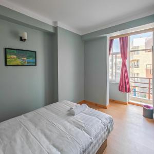 Letto o letti in una camera di Boudha Apart Hotel