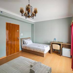 Letto o letti in una camera di Boudha Apart Hotel