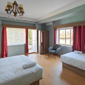 Letto o letti in una camera di Boudha Apart Hotel