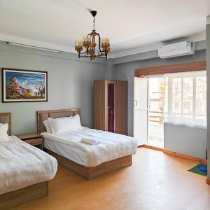 Letto o letti in una camera di Boudha Apart Hotel