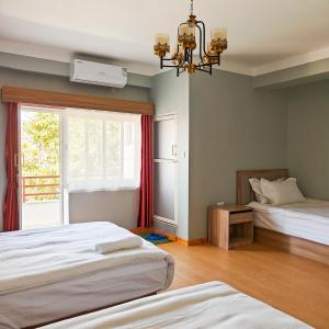 Letto o letti in una camera di Boudha Apart Hotel