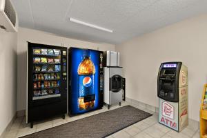 a soda machine and a drink cooler in a room at Red Roof Inn Cleveland - Westlake in Westlake