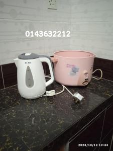 a toaster and a mixer sitting on a counter at Ekaira homestay in Tambun