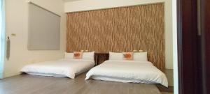 Giường trong phòng chung tại Redbean Guesthouse