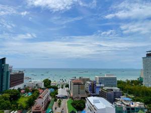a view of a city with the ocean in the background at The Base Central Pattaya apartments in Pattaya Central