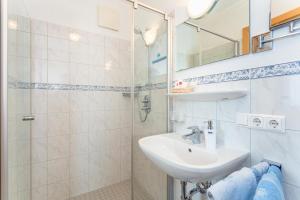 a bathroom with a sink and a shower at Stanglehen in Mittersill