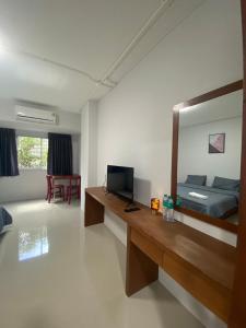 a room with a bedroom with a bed and a mirror at ศิวพฤกษ์ เพลส in Nonthaburi