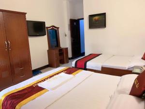 Posteľ alebo postele v izbe v ubytovaní Tran Bui Hotel 240-242 Phan Xích Long, Q Phú Nhuận - by Bay Luxury