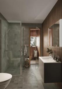 a bathroom with a tub and a sink and a shower at Tännäskröket in Tännäs +141 photos