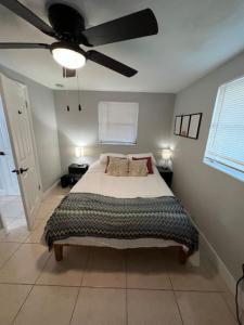 a bedroom with a bed and a ceiling fan at Busch Gardens Bliss Retreat 1 Bedroom in Tampa