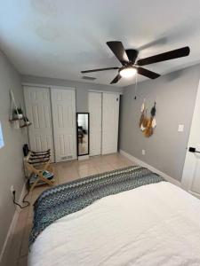 a bedroom with a bed and a ceiling fan at Busch Gardens Bliss Retreat 1 Bedroom in Tampa