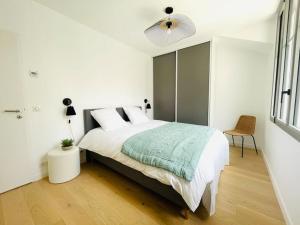 מיטה או מיטות בחדר ב-Villa Mary-Alex La Baule