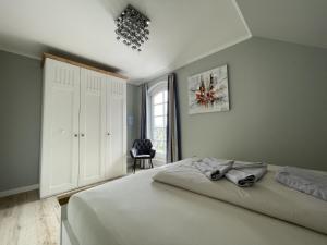 Postel nebo postele na pokoji v ubytování Landhaus Dünen