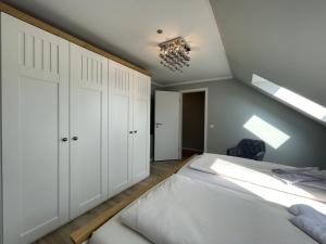 Postel nebo postele na pokoji v ubytování Landhaus Dünen