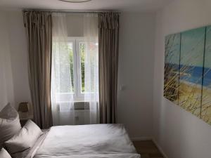 Ένα ή περισσότερα κρεβάτια σε δωμάτιο στο Fievfoten EG