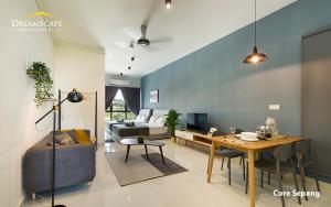 a living room with a couch and a table in it at Alanis & Core Soho Suite KLIA-KLIA2 By DreamScape in Sepang