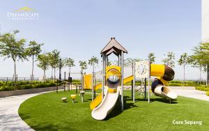 a playground with a slide in a park at Alanis & Core Soho Suite KLIA-KLIA2 By DreamScape in Sepang