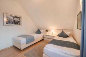 Ένα ή περισσότερα κρεβάτια σε δωμάτιο στο Ferienhaus am Wolgastsee