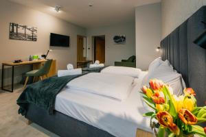 Łóżko lub łóżka w pokoju w obiekcie Country Club Żywiec Hotel i Domki Całoroczne