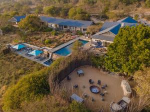 an aerial view of a house with a swimming pool at Valley Lodge - Babanango Game Reserve in Dundee