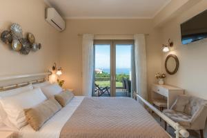 a bedroom with a bed and a chair and a window at Aleli Villas with Tennis Court in Minia