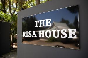 a sign that says the russian house on a building at The Risa House in Muldersdrift