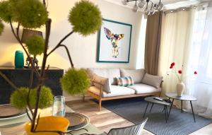 a living room with a couch and a table at Arina & Julien La Défense-Paris in Suresnes