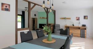 a dining room with a table and chairs at Ferienhaus | Blick zur Ahr in Antweiler
