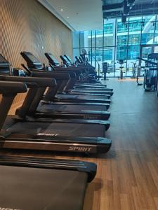 a row of treadmills lined up in a gym at 7 Palm Jumeirah in Dubai