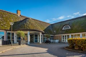 an old building with a grass roof at Thon Partner Hotel Sorø in Sorø