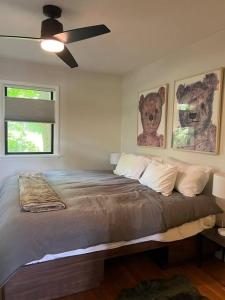 a bedroom with a bed with a teddy bear on it at Schoolhouse No. 11 * Hudson Valley Upstate Getaway in Stone Ridge