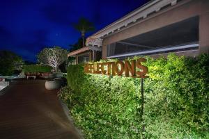 a sign that says lights in front of a building at The Nai Harn in Nai Harn Beach