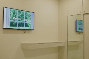 Televisyen dan/atau pusat hiburan di S.P.C Apartment by Brodderud