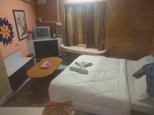 Postel nebo postele na pokoji v ubytování Hotel Desert