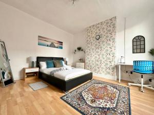 a bedroom with a bed and a desk and a rug at (S16) Bright Leeds City House in Roundhay