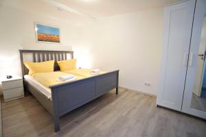 Ein Bett oder Betten in einem Zimmer der Unterkunft Haus Vilma